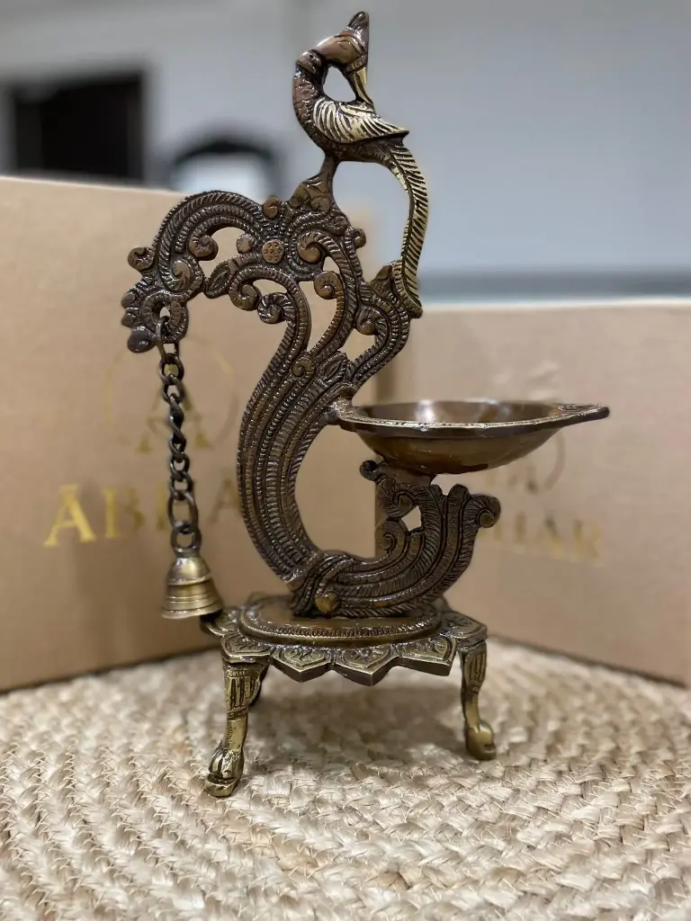 Brass Peacock Diya with a bell |