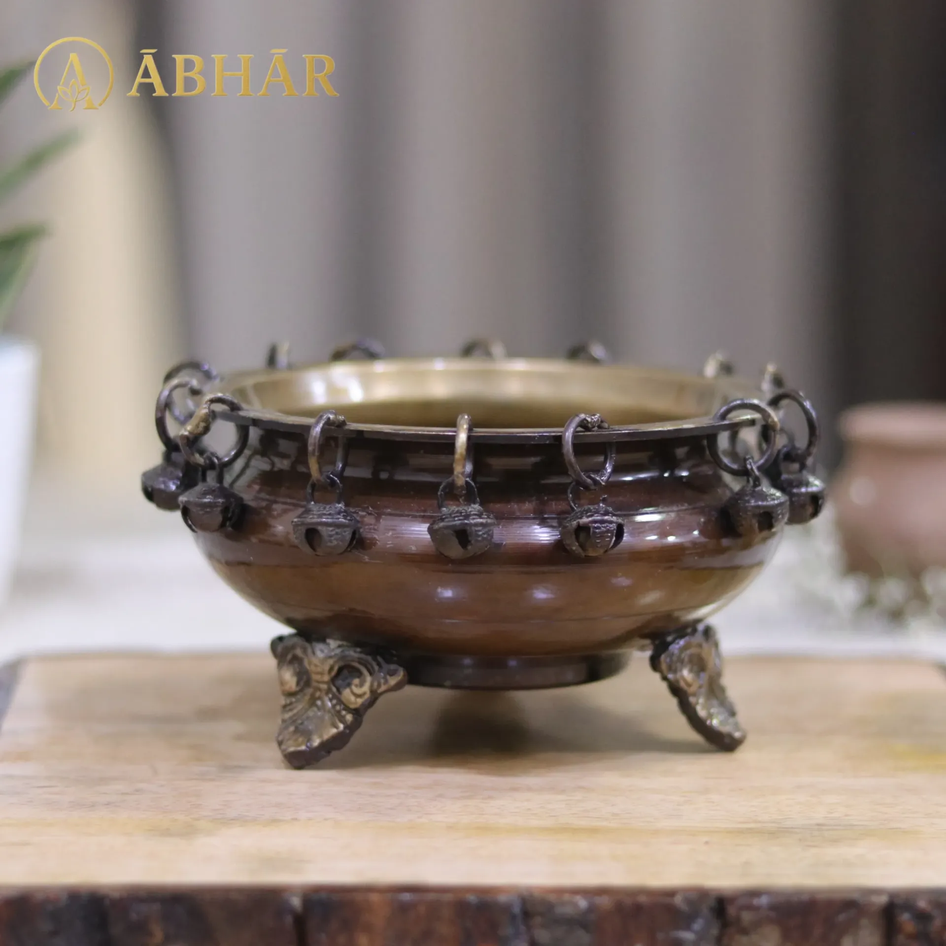 Brass Urli with Ghungroos and stand– Echoes of Elegance